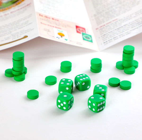 closeup of green dice and small wooden discs