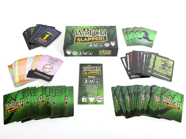 Witch Slapped components: rulebook, witch cards, spell cards, spell effects cards, numbered cards